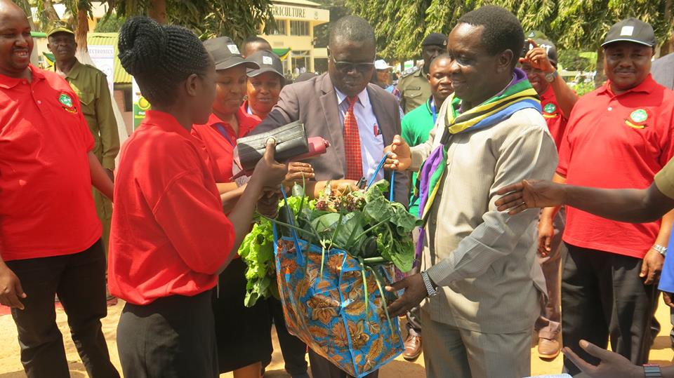 Tanzania Minister for Industries, Trade and Investiment Hon. Charles Mwijage (right) visiting Sokoine University of Agriculture at Nane Nane 2018 together with vice Chancellor Prof. Raphael Chibunda